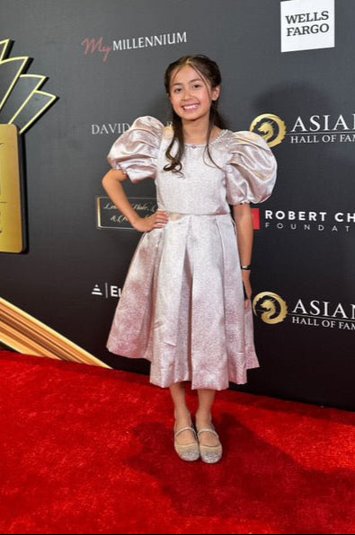 Medeleine is wearing Aurora Puff Sleeve Pearl Dress
